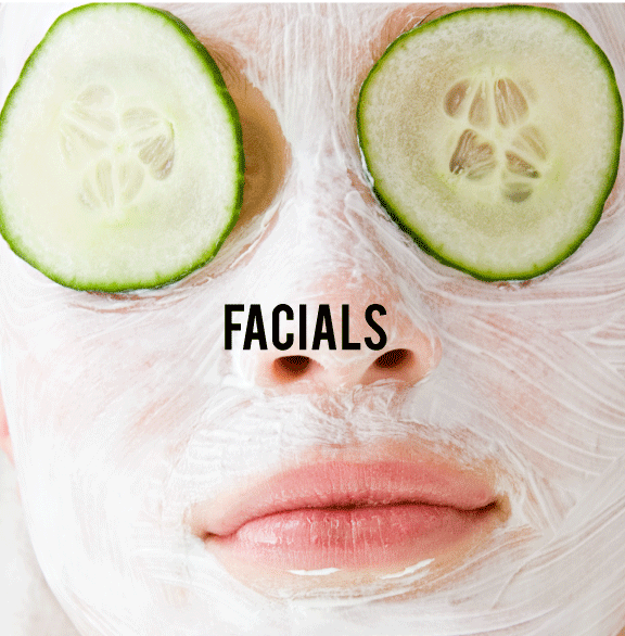 Facial with pack and cucumber in eyes